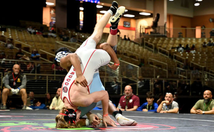 Jovani Solis of Somerset gets a 5-3 overtime win against Tanner Spalding during the 132-pound title match on Saturday at the Knockout Christmas Classic at Silver Spurs Arena in Kissimmee.